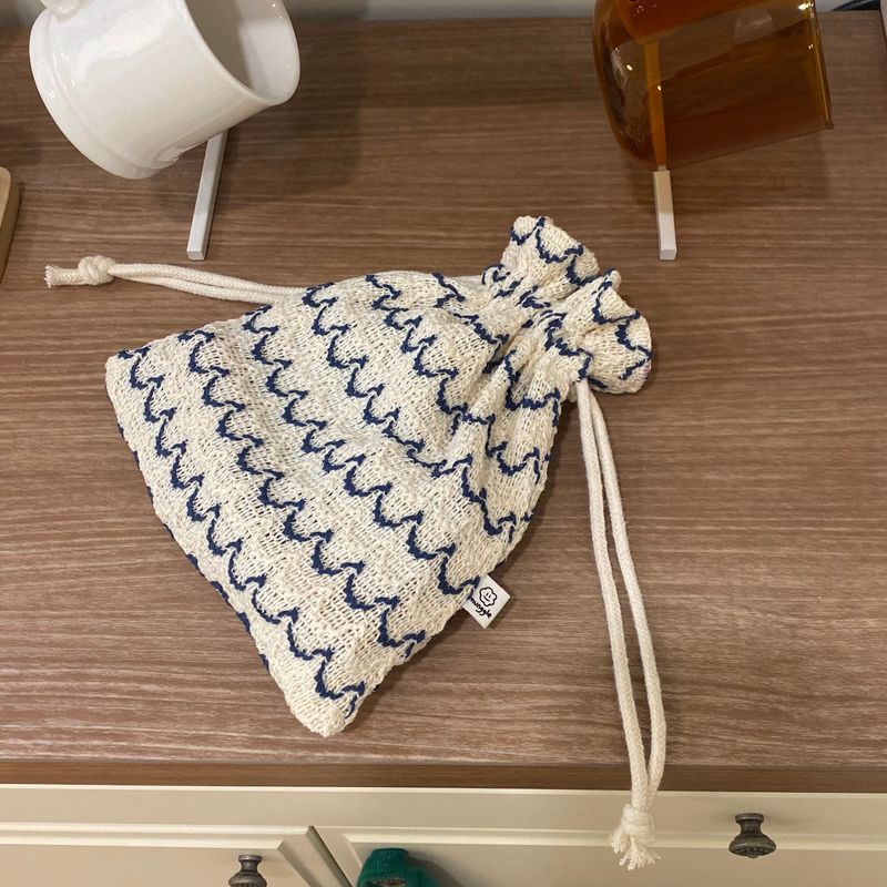 munggle market(ムングルマーケット)の「WAVE STRING POUCH(Smartphone Accessories)」