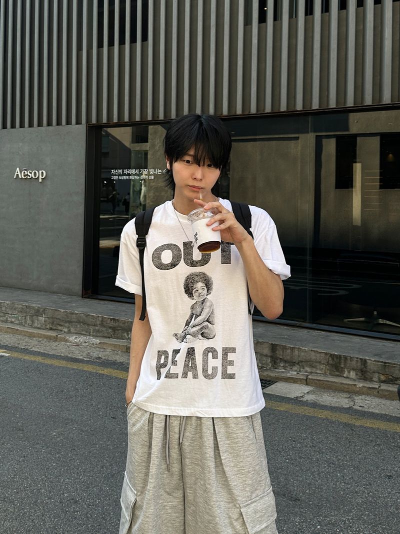 WHAT A LOOK（ワット ア ルック）の「Lumen Afro Graphic Print T-Shirt（Tops）」