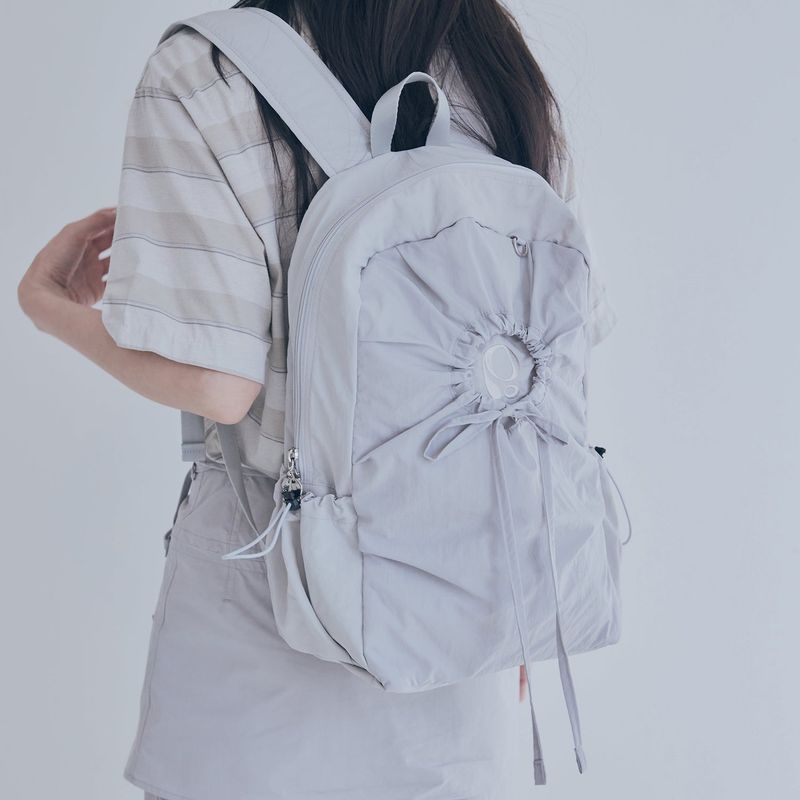 poie（ポイエ）の「hole string po backpack (light grey)（Bags）」
