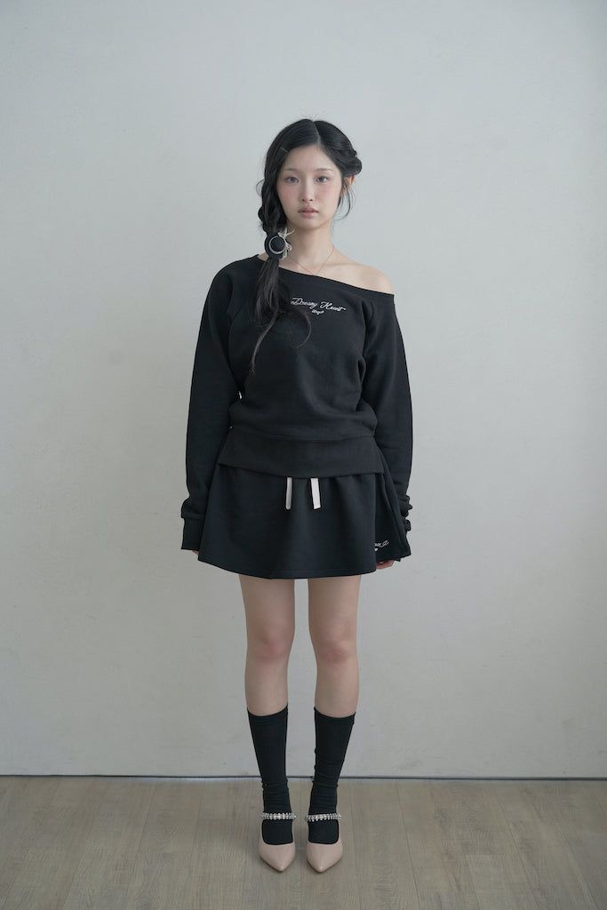 KanaJ（カナジェイ）の「ドリーミーハートワンオープンショルダー MTM - black（トップス）」