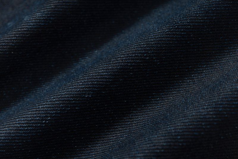 COATED KNIFE-SCRAPED HAND-WIPED DISTRESSED BOOTCUT JEANS