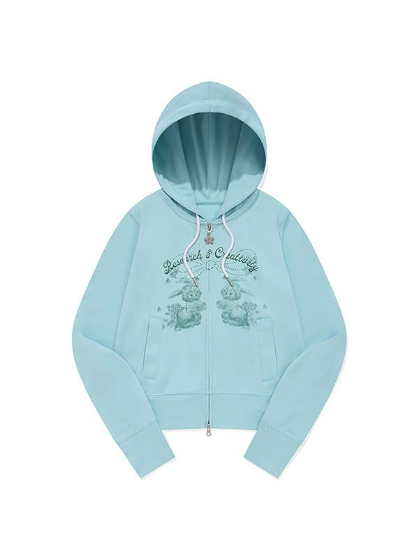 KIRSH（キルシー）の「WITTY BUNNY BOUQUET GIRL CROP HOODIE ZIP UP [ICE]（Tops）」