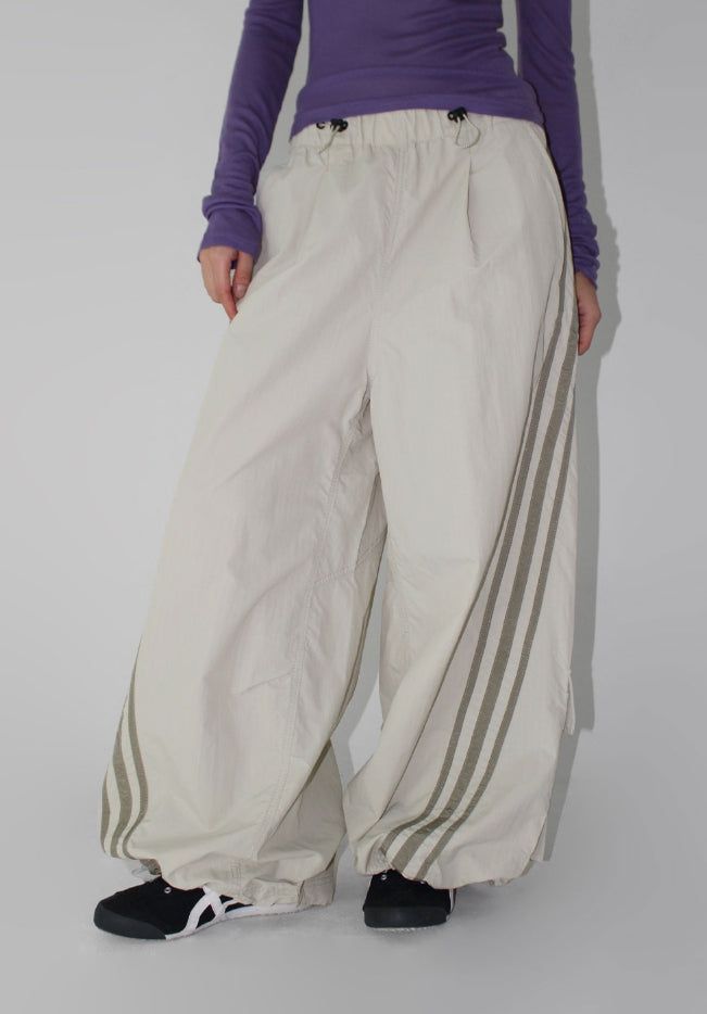 AAKE(アケ)の「CURVED TRACK NYLON PANTS(Pants)」