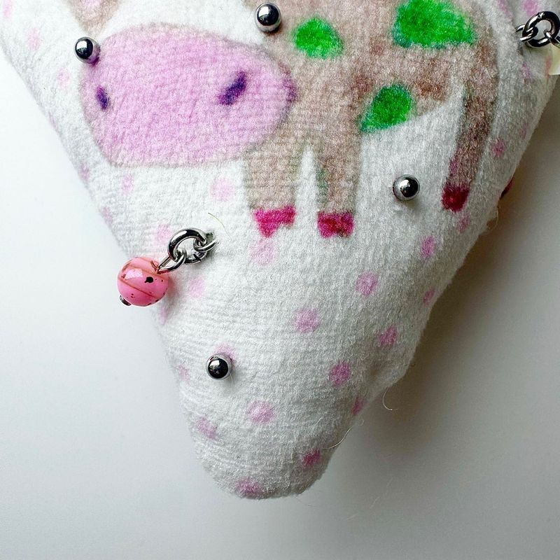 Pierced pinky cow keychain
