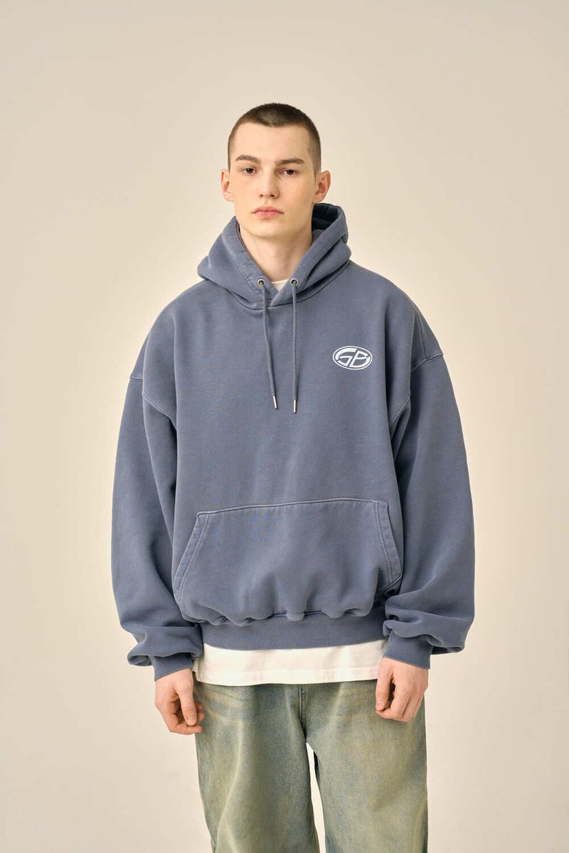 GUBIN(グビン)の「PIGMENT OVERSIZED LOGO HOOD - BLUE(Tops)」