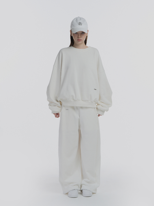 mnem（ムネム）の「[mnem] pintuck logo jogger pants (white)（Pants）」