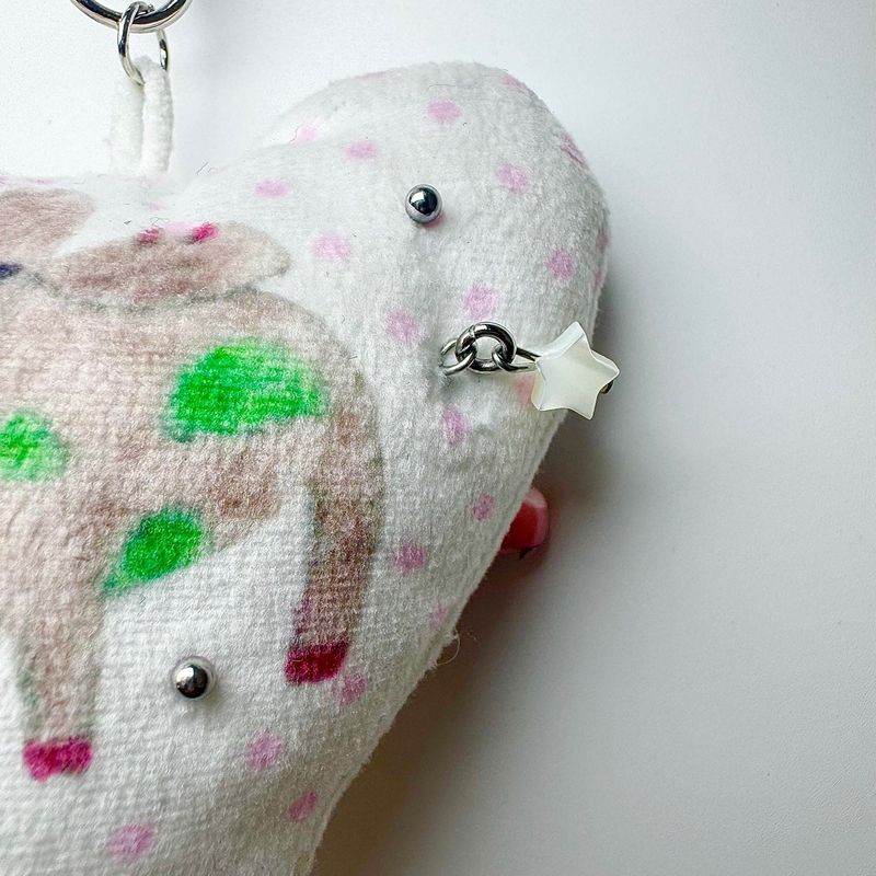 Pierced pinky cow keychain