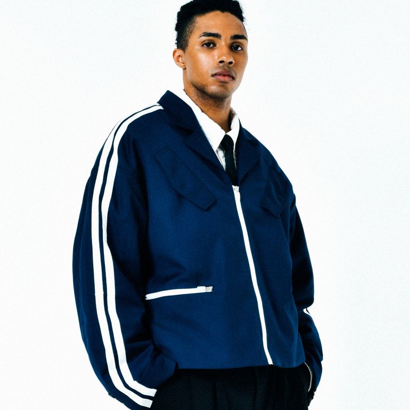 C.O.M.E（シーオーエムイー）の「[UNISEX] Satin-Trimmed Padded Racing Jacket (Navy)（Jackets/Outerwear）」