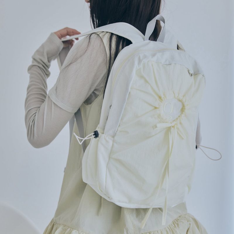 poie（ポイエ）の「hole string po backpack (light yellow)（Bags）」