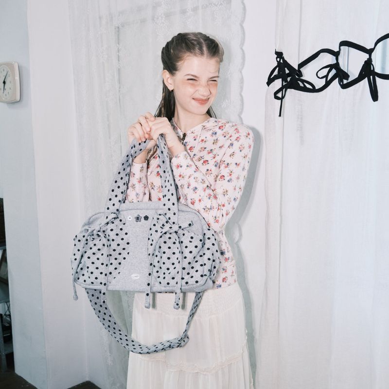 cozing(コジング)の「Dot button bag_grey(Bags)」
