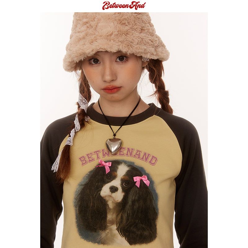 BETWEENAND(ビトゥウィーンアンド)の「リボンドッグデザインラグラン長袖Tシャツ(トップス)」