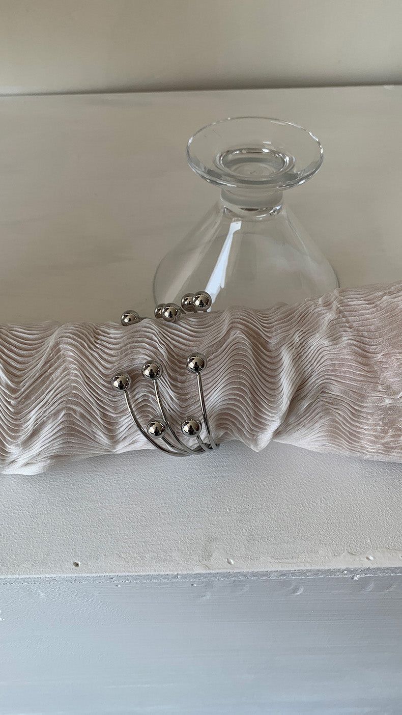 Silver ball piercing bangle