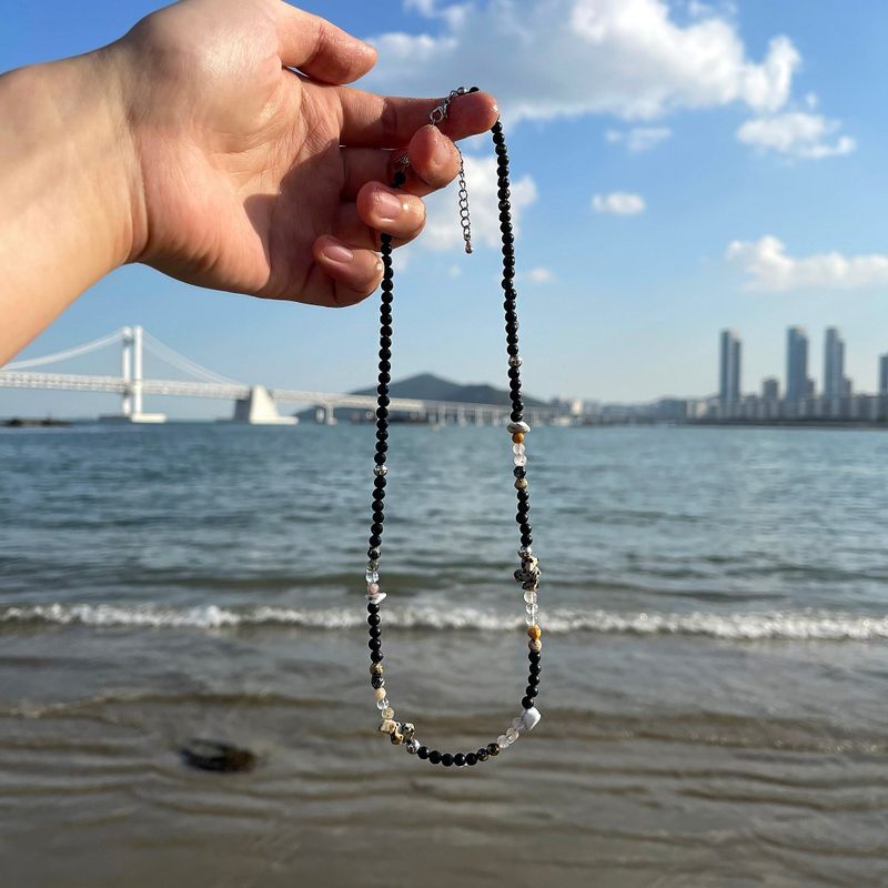 COZINESS（コジネス）の「BYATTENTION Onyx Mix Ball Necklace（Accessories）」