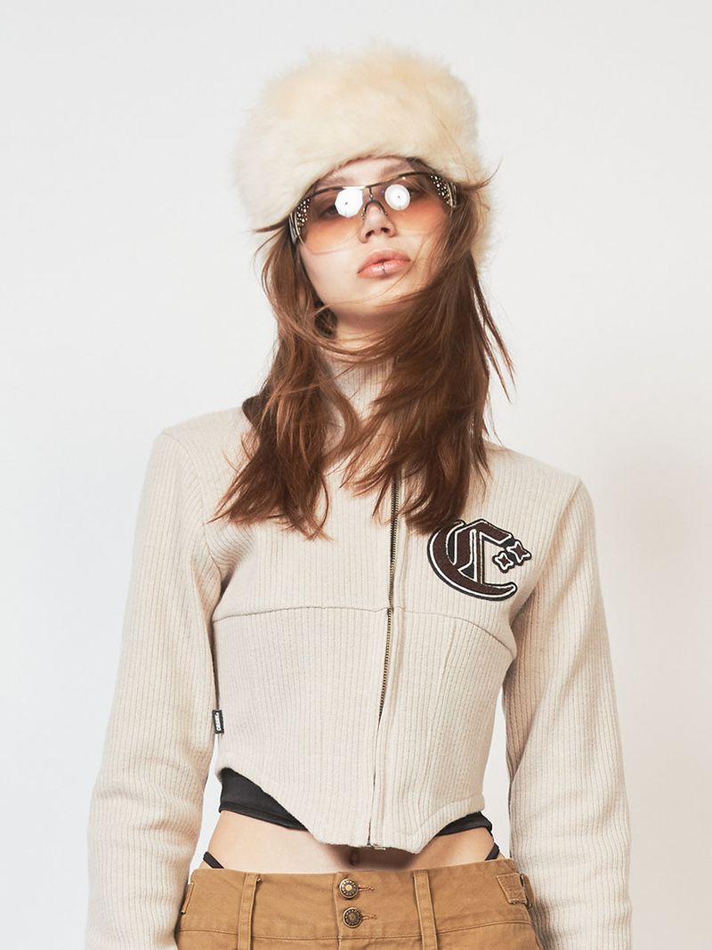 crank（クランク）の「CORSET KNIT ZIP-UP_BE（Tops）」