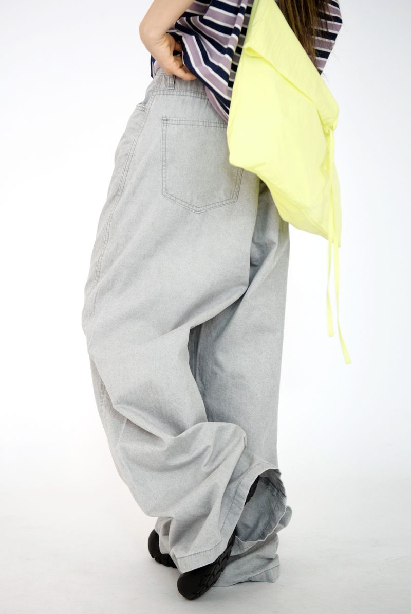 over wide gray pants