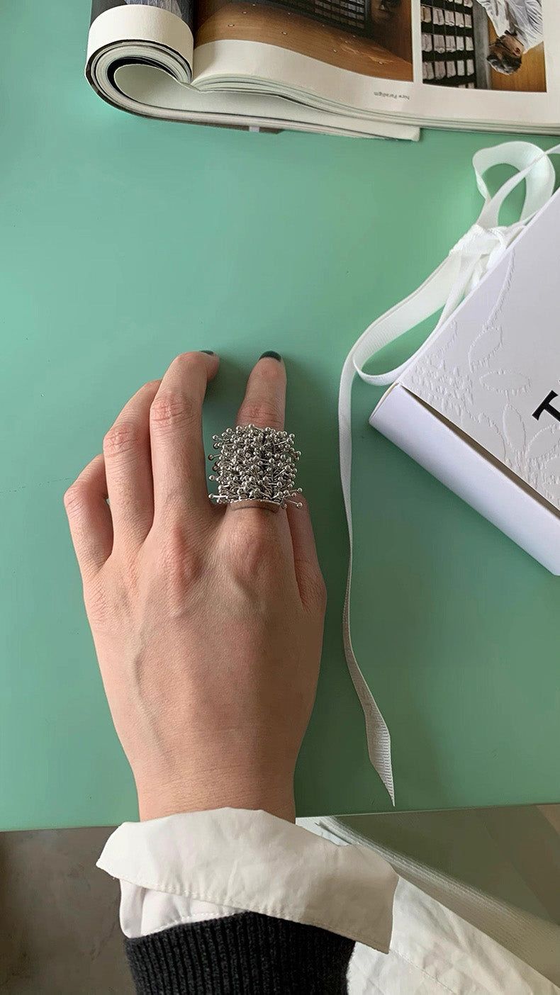 Bold silver line ball tassel ring
