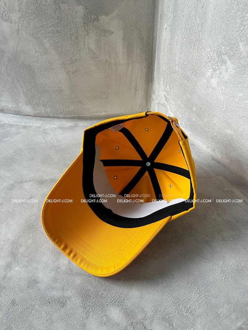 Yellow lettering ball cap