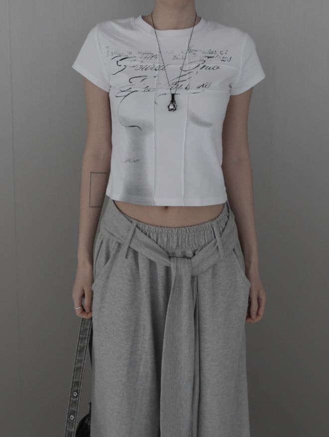 mnem（ムネム）の「Rail Pintuck Printed Short Sleeve T-shirt（Tops）」