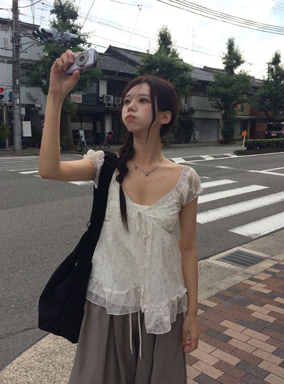 anyonemore（エニーワンモアー）の「Rijin Flower Frill Flare Chiffon Blouse（Tops）」