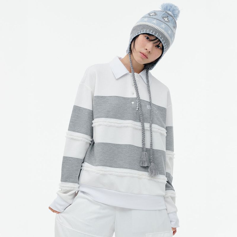 TUOMIO（トゥオミオ）の「RUFFLE POLO TOP [HEATHER GREY]（Tops）」