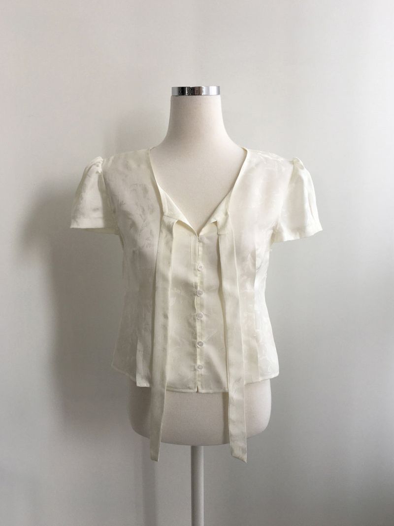 Jacquard tie puff blouse
