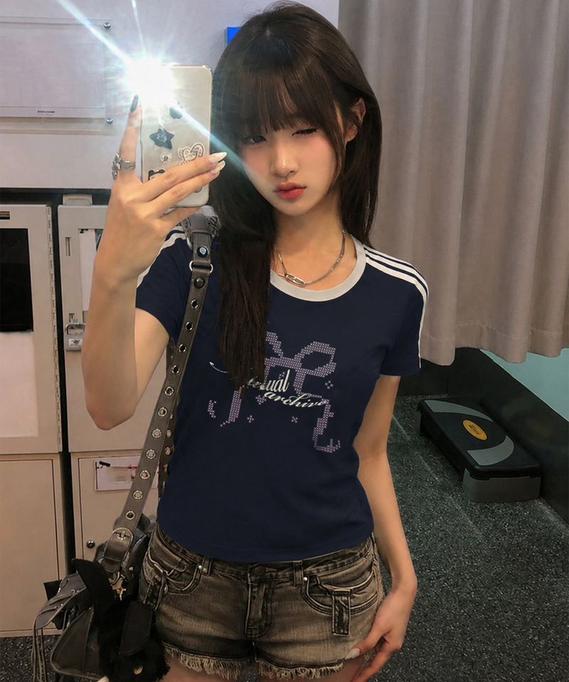 NOTUSUAL(ノットユージュアル)の「X Ribbon Semi Crop T-Shirts - 6COLOR(Tops)」
