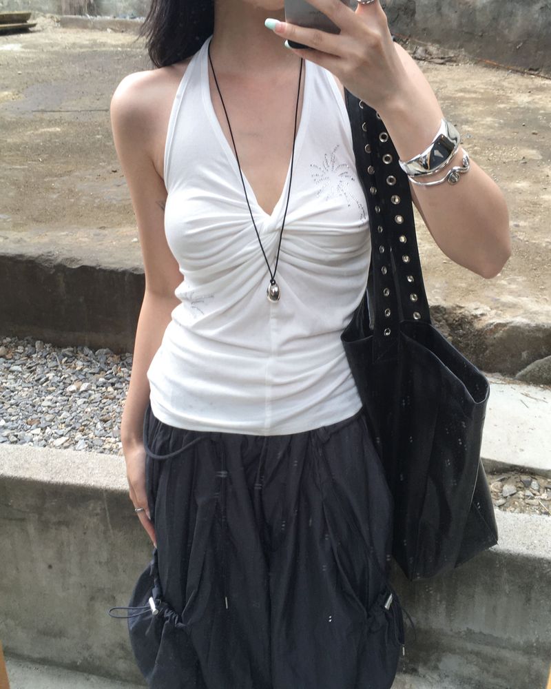 Cubic twisted sleeveless