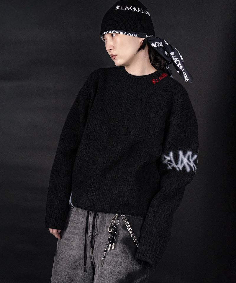 BLACKBLOND（ブラックブロンド）の「BBD ディスオーダーグラフィティロゴセーター (ブラック)（トップス）」