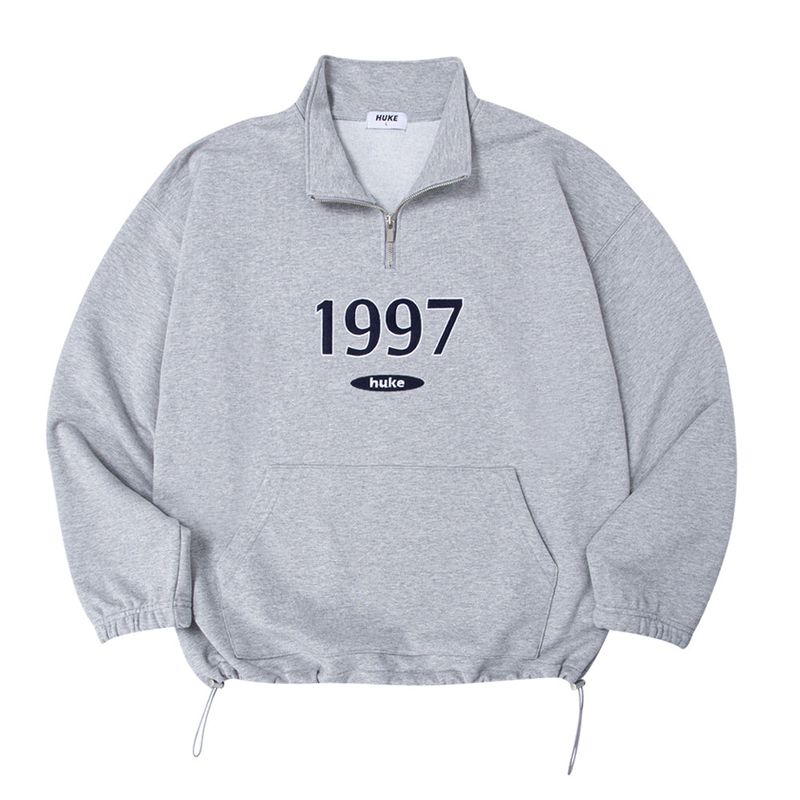 HUKE（フック）の「1997 ロゴ ジップアップ MTM (グレー)（トップス）」