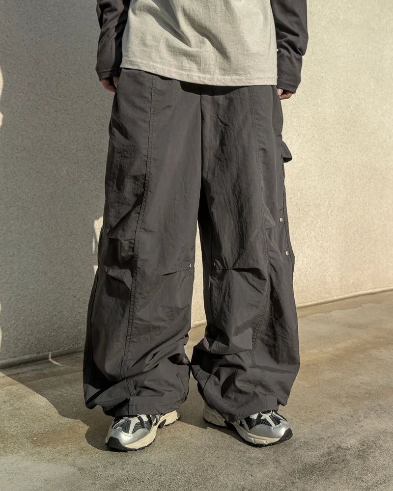 JIIGEUM（ジグム）の「ドック リベット パネル ナイロン パンツ（パンツ）」