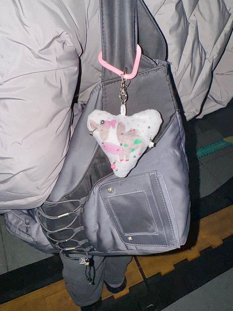 Pierced pinky cow keychain