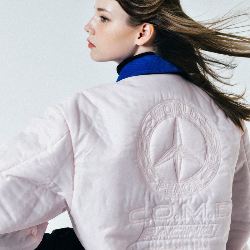 C.O.M.E（シーオーエムイー）の「[UNISEX] Reversible "WORLD PEACE" Padded Bomber Jacket (Light Pink)（Jackets/Outerwear）」