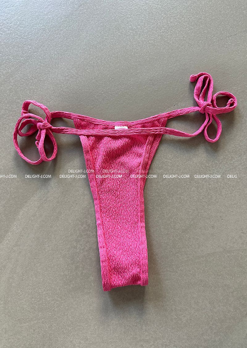 a set of 2 layered colored bikinis