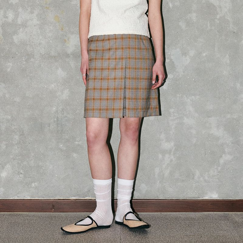 CORCA（コルカ）の「Check Triangle Skirt Orange（Skirts）」