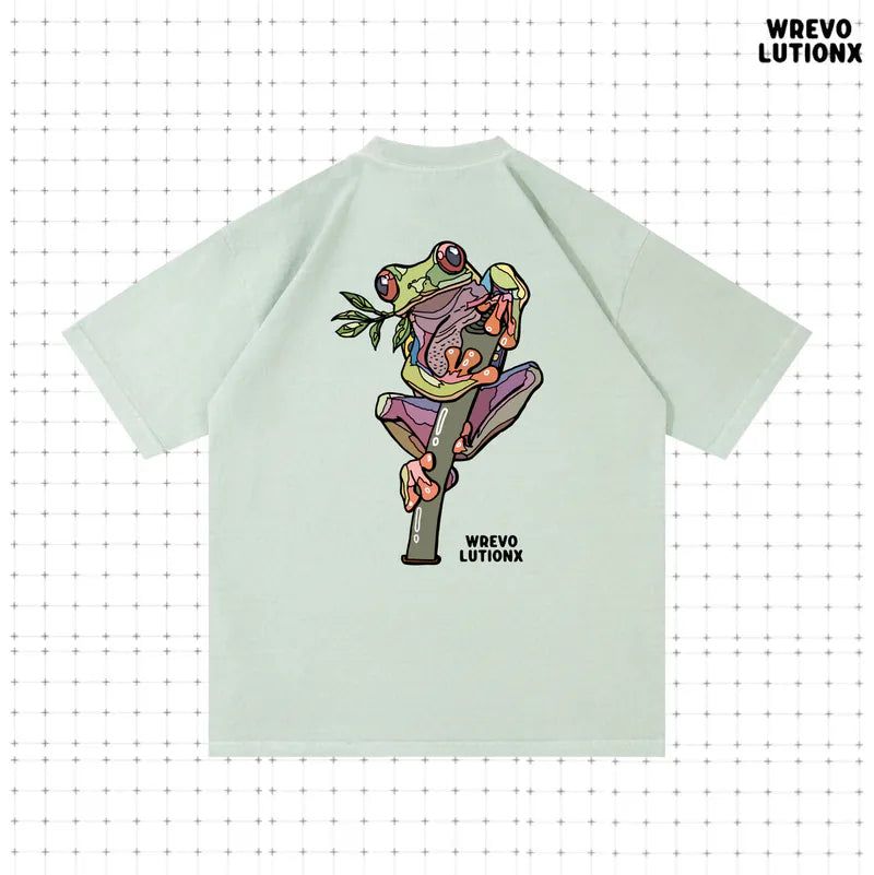 WREVOLUTIONX by WooLeeX（レボリューションエックス バイ ウーリーエックス）の「Rainforest Mint Green Denim-Washed Heavy-Weight T-Shirt(Red-eyed Tree Frog)（Tops）」