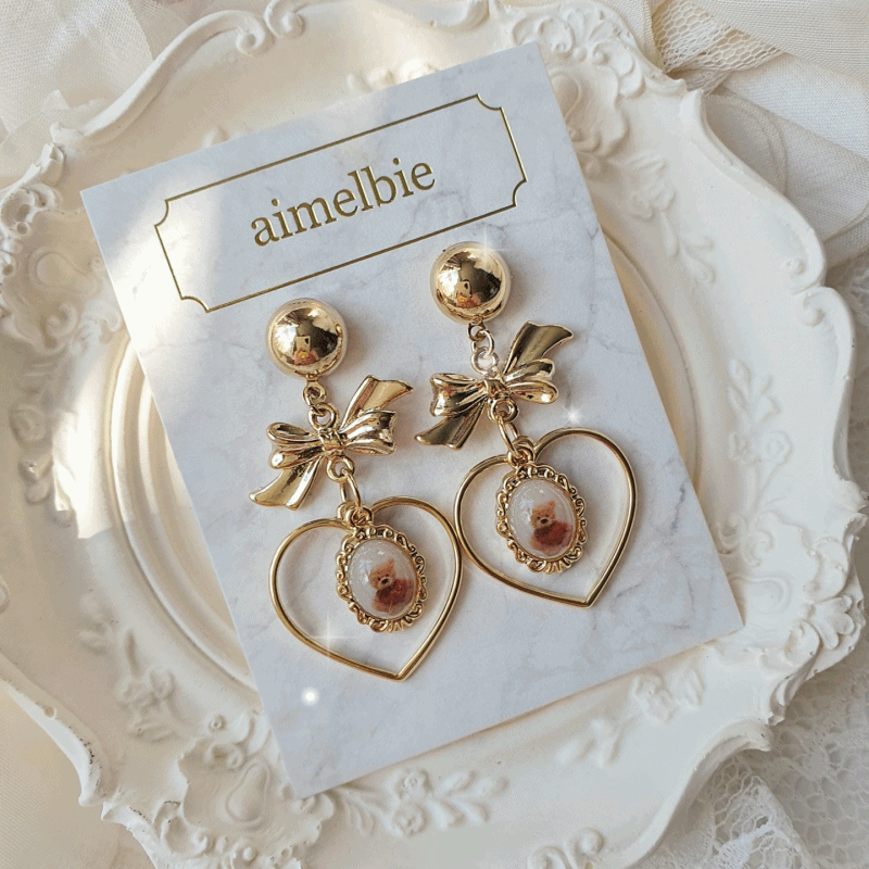 aimelbie（アイメルビー）の「ビンテージテディベアハートアンドリボンイヤリング（アクセサリー）」