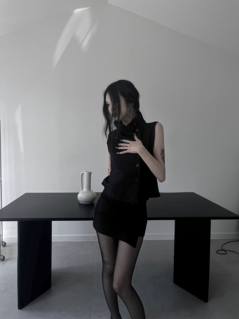 high-neck black button vest
