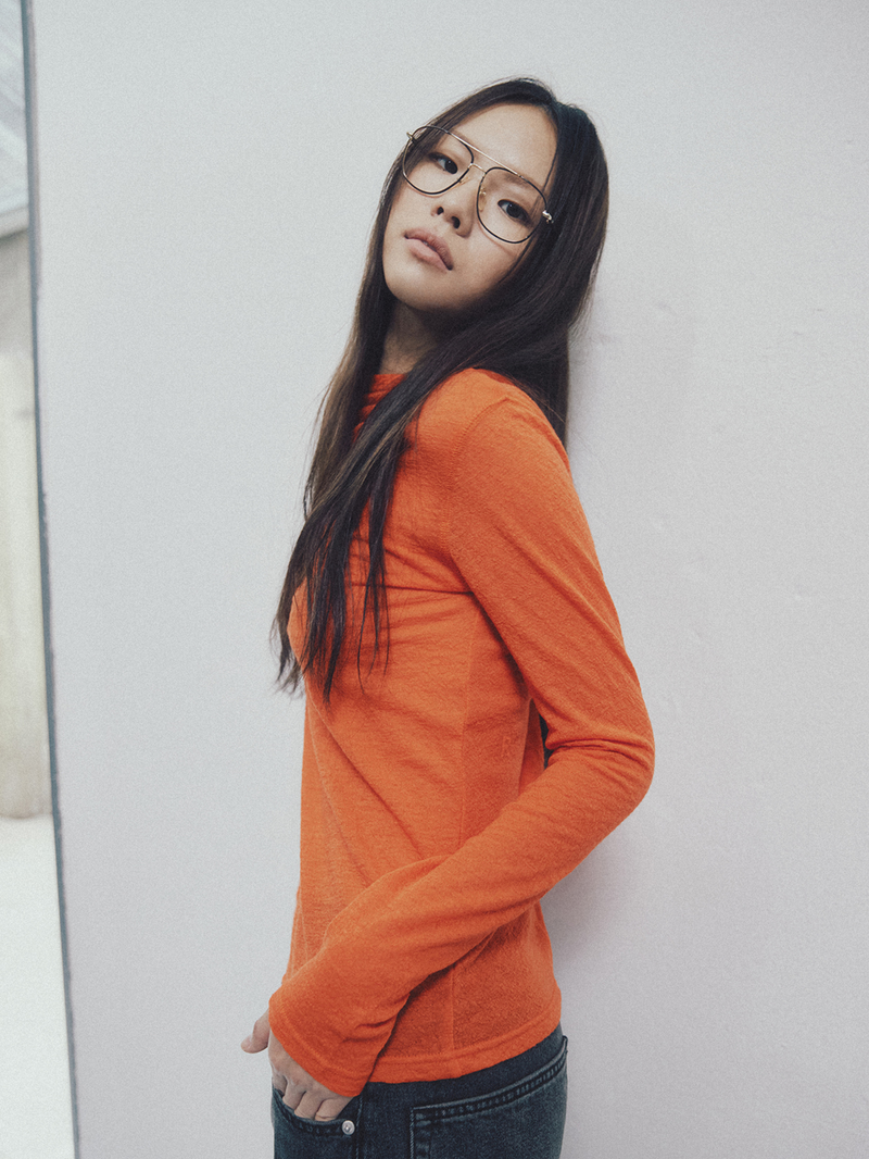 REALITY FICTION(リアリティーフィクション)の「Unbalanced Stitch Turtleneck Tee Orange(Tops)」