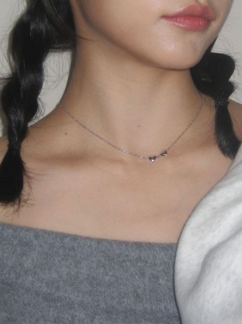 Two heart symbol necklace