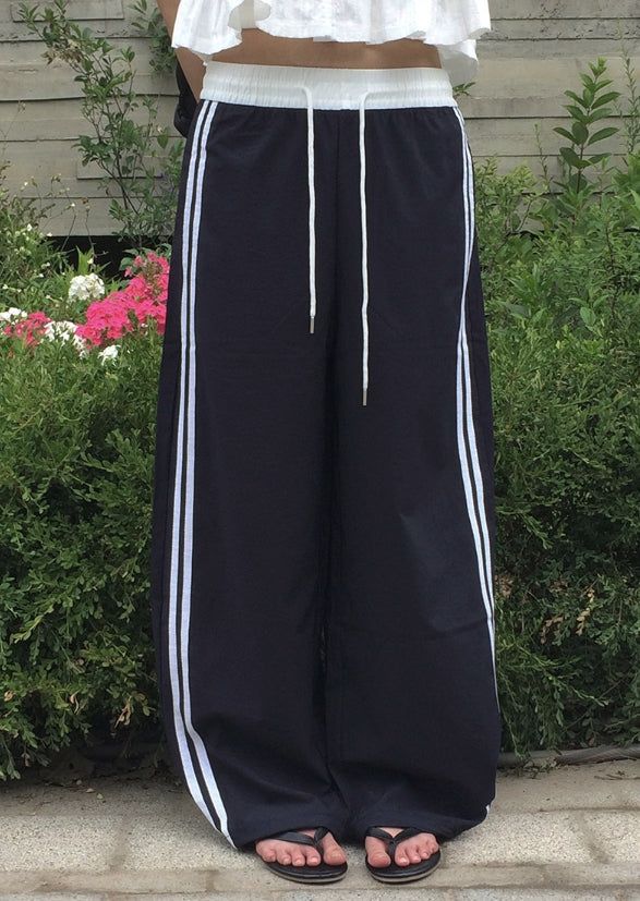 anyonemore（エニーワンモアー）の「Deumyo Color Matching Track Nylon Banding Wide Pants（Pants）」