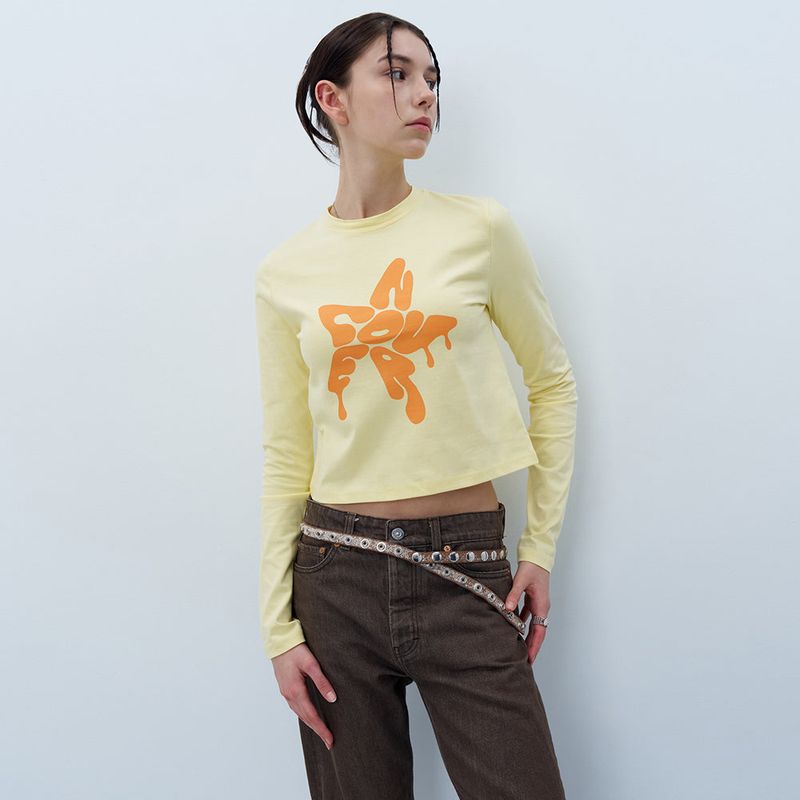 NCOVER(エンカバー)の「MELTING STAR LOGO CROP LONG SLEEVE-YELLOW(Tops)」