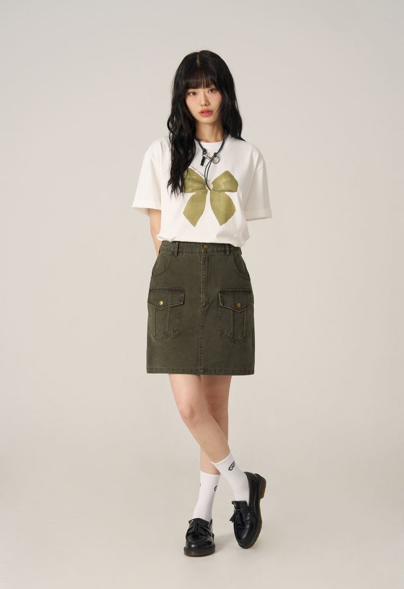 GUBIN（グビン）の「Lettering Ribbon Short-Sleeved T-shirt（Tops）」