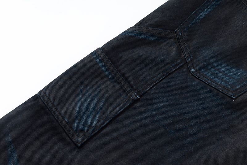 COATED KNIFE-SCRAPED HAND-WIPED DISTRESSED BOOTCUT JEANS