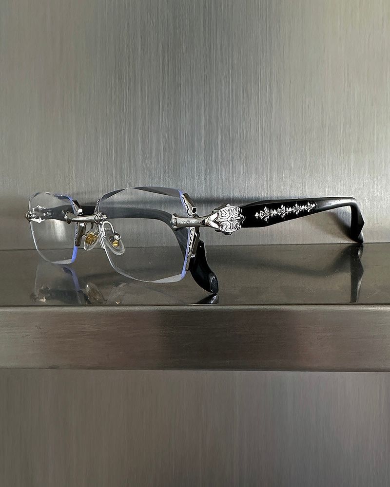 chrome cross-rimmed glasses