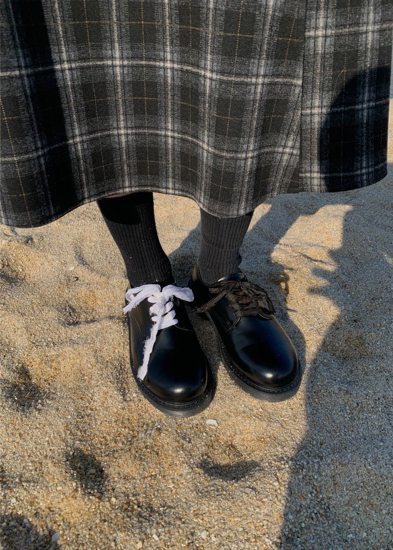 A BLACK CHECK SKIRT