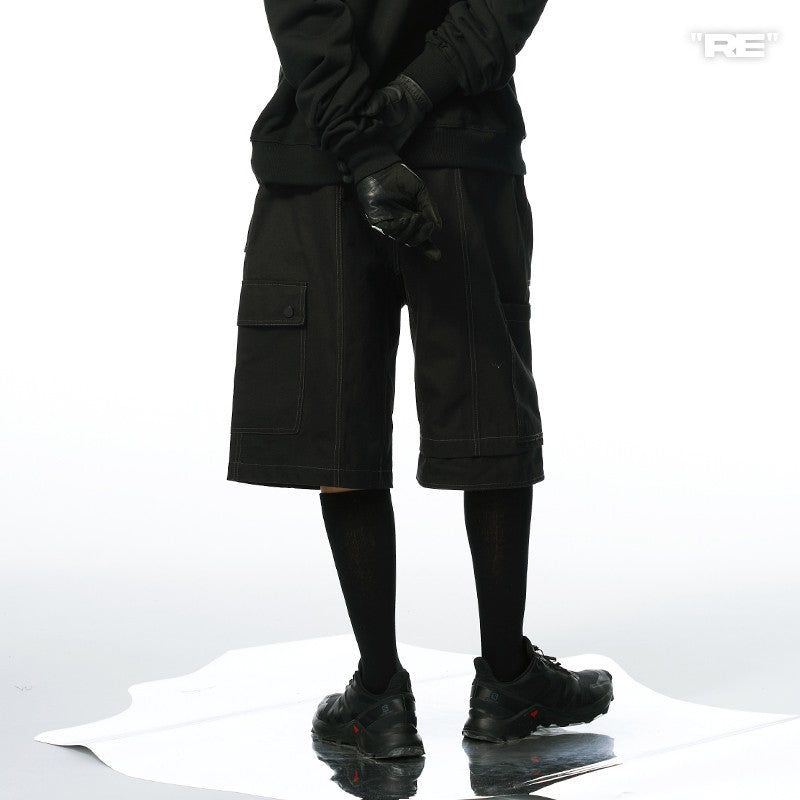RELABEL（リレーベル）の「RELABEL Loose External Pockets, Multi-Layered Segmented Splicing and Deconstruction, Metal Stud Decoration, Shorts（Pants）」