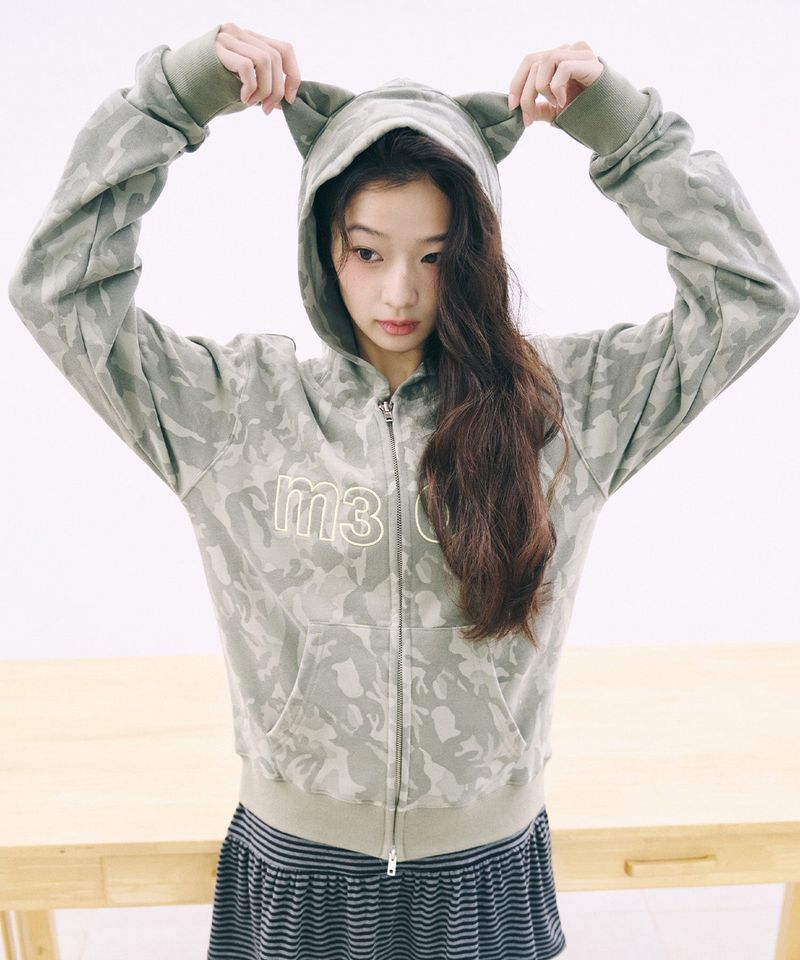 ITZAVIBE（イッザバイブ）の「M3OW CAT EAR HOODIE ZIP UP - CAMO（Tops）」