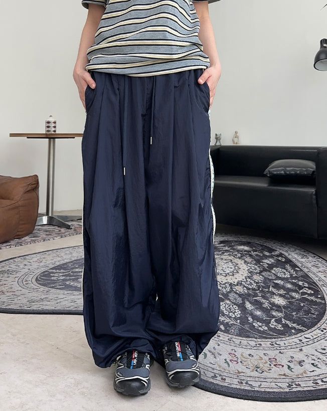 SATIIIZ（サティーズ）の「ザ ケンエスニックトラックナイロンパンツ（パンツ）」