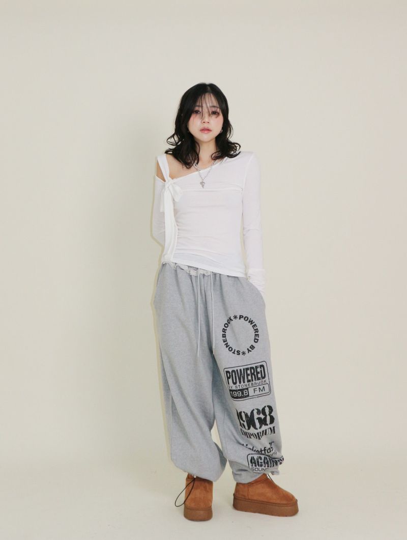 UZYOUNG（ユズヨン）の「(起毛Tシャツ)ユーレン ワンショルダーリボンタイ 長袖ウォーマーTシャツ（トップス）」
