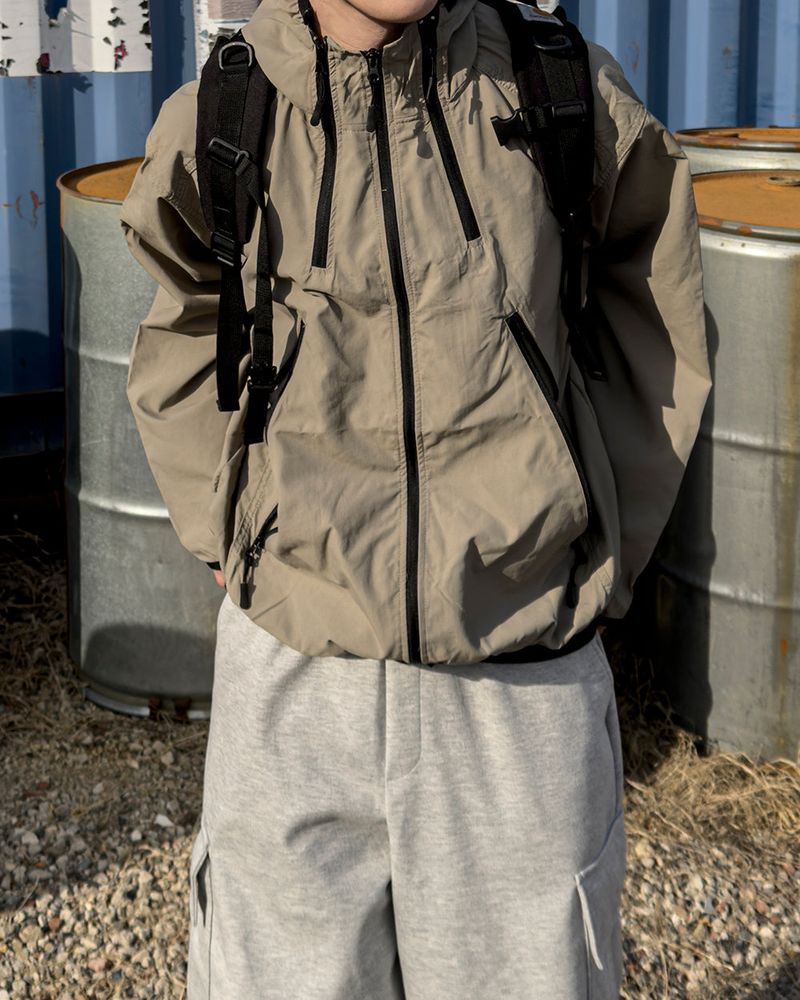 JIIGEUM（ジグム）の「CALVET Zip-Up Hooded Windbreaker（Jackets/Outerwear）」